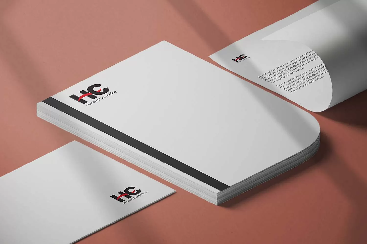 Projekt materiałów firmowych Hundert Consulting